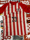 Red and white jersey #23